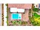 Aerial view of a backyard featuring a pool, spa, fire pit, and patio perfect for outdoor living at 10668 Porta Romana Ct, Las Vegas, NV 89141