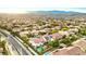 A Primary-planned community featuring tree-lined streets, well-maintained homes, and mountain views at 10668 Porta Romana Ct, Las Vegas, NV 89141