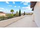Outdoor balcony with metal railing and views of the surrounding landscape at 10668 Porta Romana Ct, Las Vegas, NV 89141