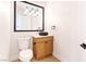Modern bathroom features a unique sink, updated vanity, and designer light fixture at 10668 Porta Romana Ct, Las Vegas, NV 89141