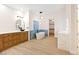 Modern bathroom with dual vanities, soaking tub, walk-in closet, and stylish fixtures at 10668 Porta Romana Ct, Las Vegas, NV 89141