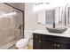 Modern bathroom features a glass enclosed shower, sleek vanity, and stylish fixtures at 10668 Porta Romana Ct, Las Vegas, NV 89141