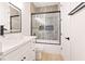 Clean bathroom with white vanity, glass bowl sink, and shower-tub combo at 10668 Porta Romana Ct, Las Vegas, NV 89141