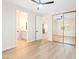 Bright, well-lit bedroom showcasing a mirrored closet, ensuite bath access, and modern design at 10668 Porta Romana Ct, Las Vegas, NV 89141