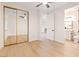 Bright bedroom with a mirrored closet and bathroom entrance at 10668 Porta Romana Ct, Las Vegas, NV 89141