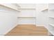 Spacious walk-in closet with ample shelving and bright lighting at 10668 Porta Romana Ct, Las Vegas, NV 89141