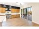 The kitchen features stainless steel appliances and sliding glass doors to a patio with a fireplace at 10668 Porta Romana Ct, Las Vegas, NV 89141