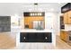 Spacious kitchen features a large center island with a black base, and stainless steel appliances at 10668 Porta Romana Ct, Las Vegas, NV 89141