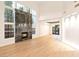 Modern living room with a fireplace, large windows, and an open floor plan at 10668 Porta Romana Ct, Las Vegas, NV 89141