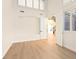 Open loft with high ceilings and clerestory windows showcases natural light and views of the wrought iron staircase at 10668 Porta Romana Ct, Las Vegas, NV 89141