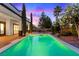 Inviting backyard pool with custom design, landscaping, and ample patio space for entertaining at 10668 Porta Romana Ct, Las Vegas, NV 89141