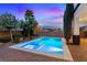 This backyard offers a sparkling pool and patio perfect for outdoor entertaining at 10668 Porta Romana Ct, Las Vegas, NV 89141