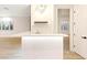 Modern wet bar with a sleek countertop, stylish lighting, and convenient access to adjacent spaces at 10668 Porta Romana Ct, Las Vegas, NV 89141