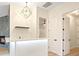 Stylish wet bar area with modern lighting, sleek countertops, and convenient access to other rooms at 10668 Porta Romana Ct, Las Vegas, NV 89141