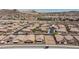Overhead view of a residential area highlighting diverse architectural styles, landscaping, and community features at 1081 Via Gandalfi, Henderson, NV 89011