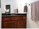 Close up of bathroom vanity, mirror, cabinet and fixtures at 1081 Via Gandalfi, Henderson, NV 89011