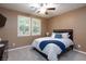 Bedroom with carpet, a ceiling fan, and two windows for natural light at 1081 Via Gandalfi, Henderson, NV 89011