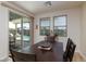 Cozy dining area with views of the backyard pool through sliding glass doors at 1081 Via Gandalfi, Henderson, NV 89011