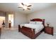 This main bedroom features a ceiling fan and wooden furniture at 1081 Via Gandalfi, Henderson, NV 89011