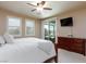 Spacious main bedroom with modern amenities and a view of the outdoor pool at 1081 Via Gandalfi, Henderson, NV 89011