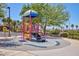Community playground with colorful play structure and surrounding landscaping provides recreational space at 1081 Via Gandalfi, Henderson, NV 89011