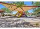Playground featuring slides, a shade canopy and nearby benches at 1081 Via Gandalfi, Henderson, NV 89011