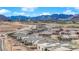 An elevated view showing new construction homes in the foreground and the expansive mountains in the background at 11049 Concord Valley Drive, Las Vegas, NV 89135