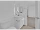 A simple vanity with a modern sink and a white toilet in a small, clean bathroom at 11049 Concord Valley Drive, Las Vegas, NV 89135