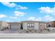 Charming single-story home featuring a neutral color scheme, low maintenance landscaping, and a two-car garage at 11049 Concord Valley Drive, Las Vegas, NV 89135