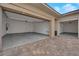 Spacious three car garage with epoxy floors and bright lighting ready for your vehicles and storage needs at 11049 Concord Valley Drive, Las Vegas, NV 89135