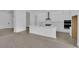 Bright open kitchen with large island, pendant lighting, and modern stainless-steel appliances at 11049 Concord Valley Drive, Las Vegas, NV 89135
