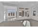 Spacious living room featuring large windows with backyard views at 11049 Concord Valley Drive, Las Vegas, NV 89135