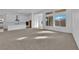 Open floorplan with large windows allowing for ample natural light and seamless flow to the kitchen at 11049 Concord Valley Drive, Las Vegas, NV 89135