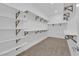 Walk-in closet with carpet and built-in shelving at 11049 Concord Valley Drive, Las Vegas, NV 89135