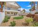 Backyard with grass, gravel, and brick retaining wall at 1109 Maserati Dr, Las Vegas, NV 89117