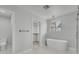 Modern bathroom features a walk-in shower, freestanding tub, and closet at 1109 Maserati Dr, Las Vegas, NV 89117