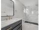Bathroom features a modern vanity with marble countertops and a glass shower at 1109 Maserati Dr, Las Vegas, NV 89117