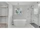 Modern bathroom features a walk-in shower, freestanding tub, and closet at 1109 Maserati Dr, Las Vegas, NV 89117