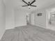Large bedroom with carpet, ceiling fan, and ensuite bathroom access at 1109 Maserati Dr, Las Vegas, NV 89117
