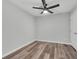 The bedroom has wood floors and a ceiling fan at 1109 Maserati Dr, Las Vegas, NV 89117
