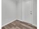 Entryway with a white door, grey walls, and wood-style vinyl flooring at 1109 Maserati Dr, Las Vegas, NV 89117