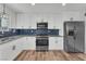 Modern kitchen features stainless steel appliances, granite countertops, and stylish cabinetry at 1109 Maserati Dr, Las Vegas, NV 89117