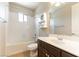 Bathroom with a single sink, shower-tub combo, and a mirrored medicine cabinet on the wall at 11228 Hedgemont Ave, Las Vegas, NV 89138