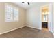 Bedroom featuring carpeted floors, a window with shutters, and an ensuite bathroom at 11228 Hedgemont Ave, Las Vegas, NV 89138