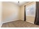 This carpeted bedroom is bright with natural light coming through the window with plantation shutters at 11228 Hedgemont Ave, Las Vegas, NV 89138