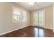 Bright bedroom features plantation shutters, tray ceiling, and access to a private balcony at 11228 Hedgemont Ave, Las Vegas, NV 89138