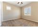 Bedroom featuring carpeted floors, a ceiling fan, and a window with shutters for natural light at 11228 Hedgemont Ave, Las Vegas, NV 89138