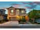 Charming two-story home featuring a well-manicured front yard and a two-car garage in a residential neighborhood at 11228 Hedgemont Ave, Las Vegas, NV 89138