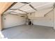 Spacious garage with epoxy floor, shelves, and a water heater at 11228 Hedgemont Ave, Las Vegas, NV 89138