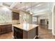 Bright kitchen with island features stainless appliances, granite countertops, and lots of natural light at 11228 Hedgemont Ave, Las Vegas, NV 89138